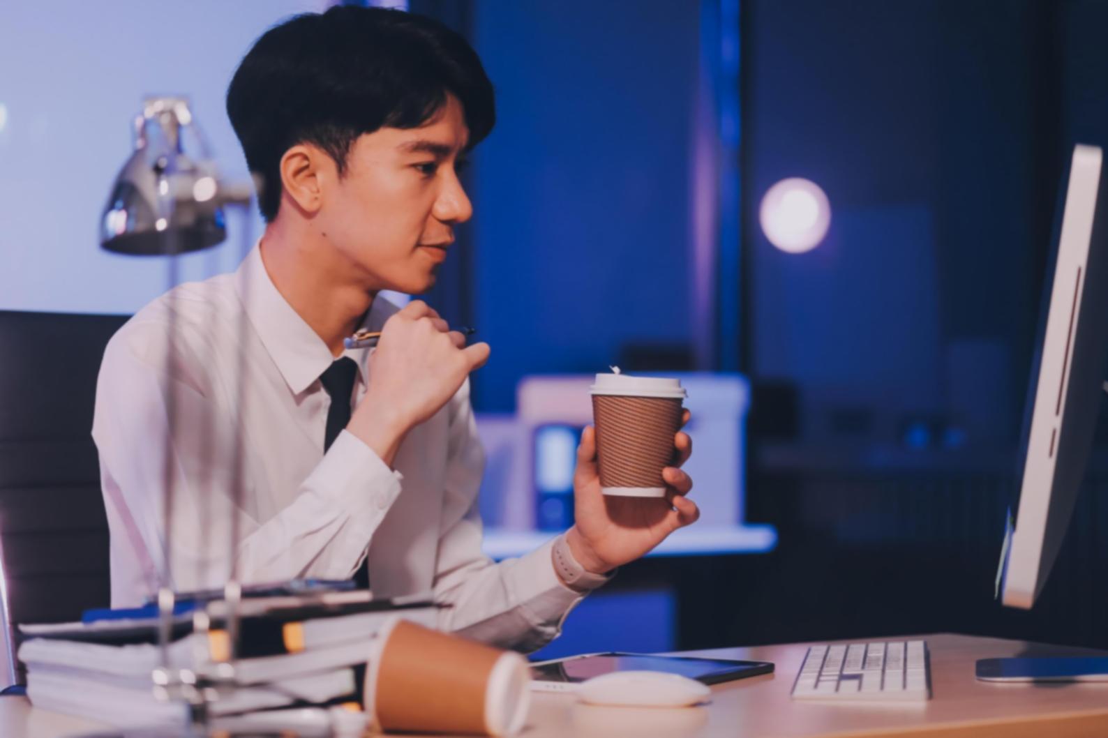 Professional financial analysis workspace with multiple monitors displaying market data, charts, and investment portfolios